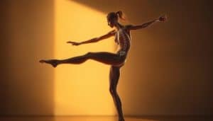 A dynamic figure in motion, their limbs flowing with graceful coordination. The body's joints and muscles work in harmony, guided by the intricate neural pathways of proprioception. The scene is bathed in a soft, warm light, casting subtle shadows that accentuate the contours of the figure's movements. The background is blurred, keeping the focus on the mesmerizing display of kinesthetic control. The image conveys a sense of effortless, innate mastery over one's physical form, a testament to the remarkable capabilities of the human sensorimotor system.